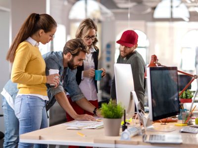 Four colleagues working together in the office